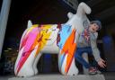 Riley Jones, 10, of Brighton, hanging around Bow Wow the David Bowie Snowdog Picture: Susannah Binney