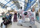 Children are intrigued by The Argus Newshound, the Snowdog which is inside Brighton Railway Station Picture: Simon Dack