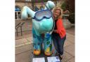 Artist Lynne Bannon is reunited with her finished Under the Sea Snowdog in position for the trail.