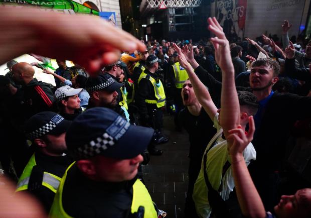 The Argus: England fans clash with police in Piccadilly Circus, London, after Italy beat England on penalties to win the UEFA Euro 2020 Final. England have been ordered to play their next home UEFA competition match behind closed