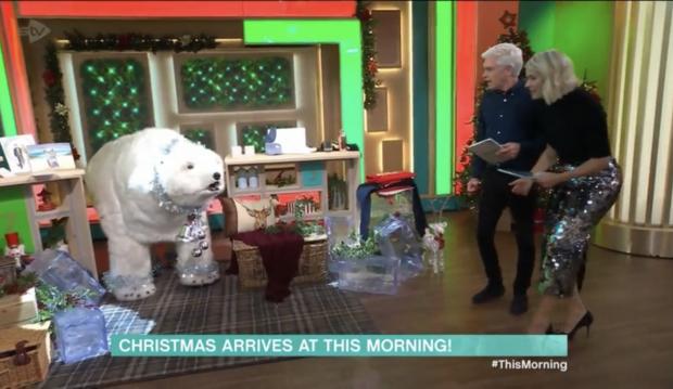 The Argus: Holly and Phillip explore the christmas decorations in the This Morning studio. Credit: ITV