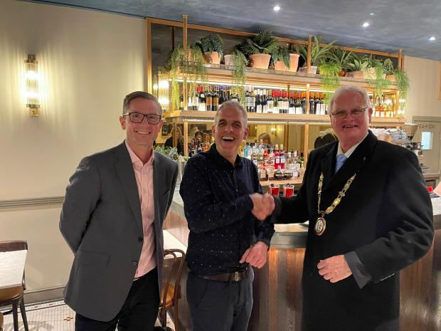 The Argus: Steve Worrall (Chief Operating Officer of Cafe Rouge and Las Iguanas) (left), Javier Llopis (General Manager) (centre) and Mayor of Haywards Heath Howard Mundin (right)