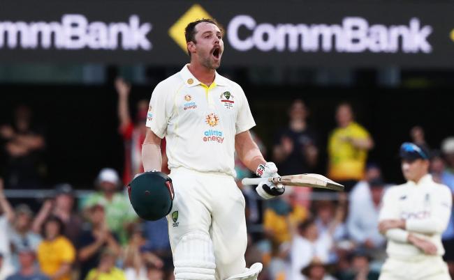Australia's Travis Head celebrates his century during day two of the first Ashes test at The Gabba, Brisbane.