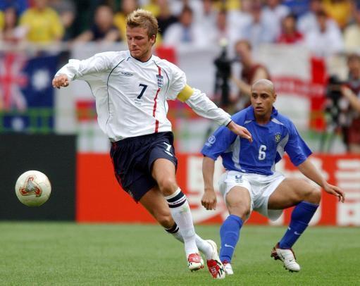 The Argus: David Beckham goes past Roberto Carlos, picture from Rui Vieira/PA Archive