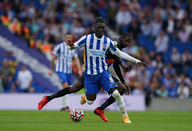 Brighton and Hove Albion's Yves Bissouma (left) evades a challenge by Everton's Abdoulaye Doucoure during the Premier League match at Amex Stadium, Brighton. Picture date: Saturday August 28, 2021.