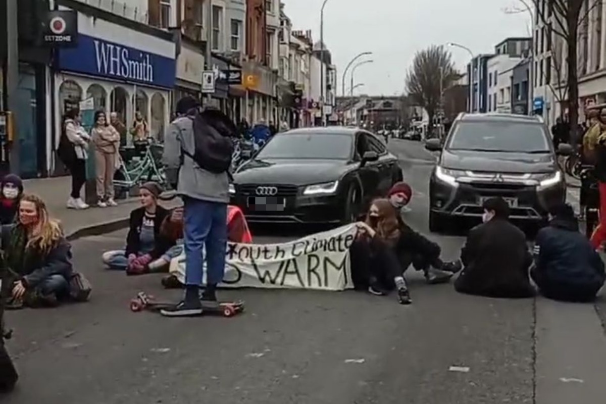 Traffic disruption in London Road, Brighton as Youth Swarm sit in road