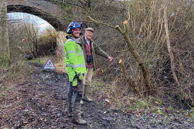 The Argus: Nick Lear of Barcombe Wildlife Community Group with a tree cutter Josh Bruce, as they discuss what's best for Barcombe's nightingales