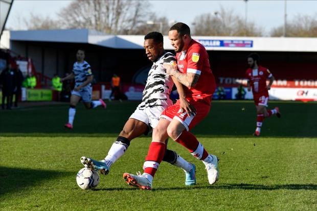 Ebrima Adams (8) of Forest Green Rovers battles for possession with Joel Lynch (37) of Crawley Town during the EFL Sky Bet League 2 match between Crawley Town and Forest Green Rovers at The People's Pension Stadium, Crawley, England on 26 February