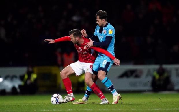 The Argus: Swindon Town's Jordan Lyden and Crawley Town's Jack Powell battle for the ball during the Sky Bet League Two match at the County Ground, Swindon
