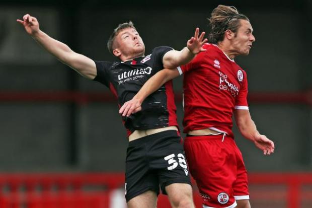 The Argus: Scunthorpe United’s Mason O’Malley (left) and Crawley Town’s Sam Matthews (right) battle for the ball during the Sky Bet League Two match at the People's Pension Stadium, Crawley.