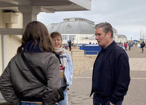 The Argus: Labour leader Keir Starmer speaking to passers-by while walking along the promenade in Worthing