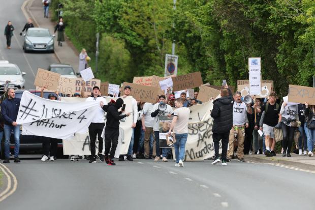 The Argus: Karl Holscher-Ermert, with megaphone, leads the crowd up Mayhew Way in Lewes 