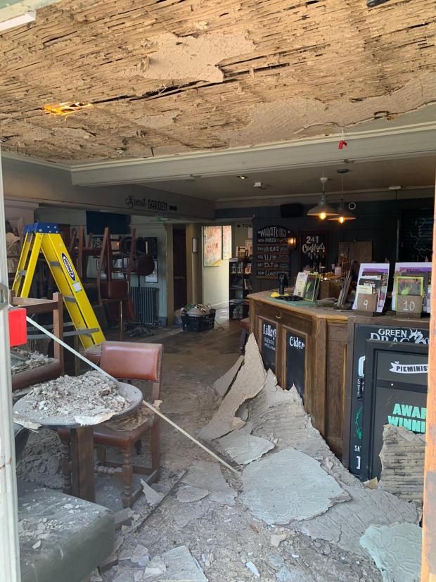 The Argus: Pictures show the exposed ceiling, with debris scattered across the bar and seating areas