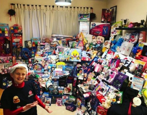The Argus: Daniel MacDiarmid with a selection of toys purchased for Chestnut Tree House Children's Hospice after a previous challenge 