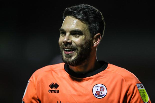 Crawley Town goalkeeper Glenn Morris smiles during the Sky Bet League Two match at the People's Pension Stadium, Crawley.