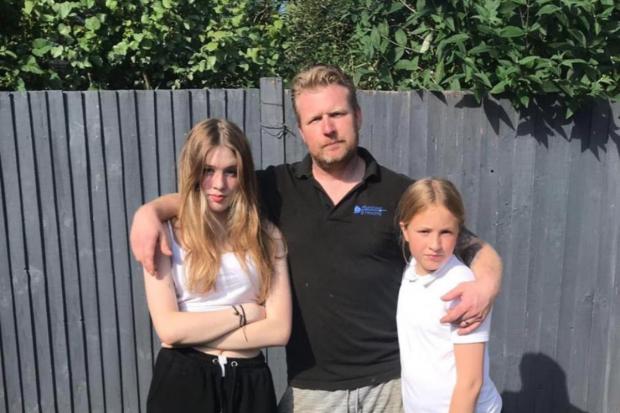The Argus: From left, Sienna, 13, who has not received a renewed passport, Chris, and Bella, 11, who has received a passport 