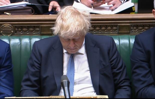 The Argus: Prime Minister Boris Johnson listens as Labour leader Keir Starmer responds to his statement to the House of Commons, London, following the publication of Sue Gray's report