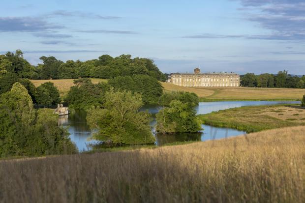 The Argus: View over the lake towards the house at Petworth, West Sussex ©National Trust Images John Miller