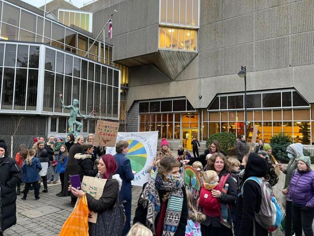 The Argus: Rally against proposed admission cuts at Hove Town Hall in December 2021