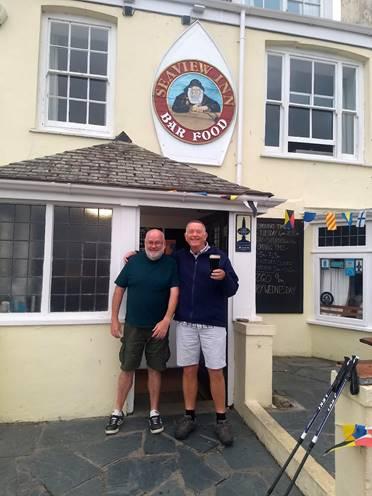 The Argus: Brian Oliver (right) with his pint after walking 400 miles from Brighton to Cornwall 