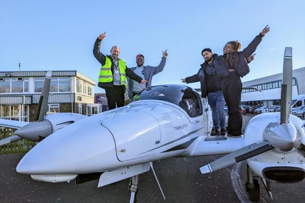 FTA Global MD Sean Jacob with students from the University of Brighton on a pilot training aircraft