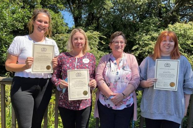 Photo: From left to right, staff members Charlotte Reynolds, Anna Janakowska, Deidre Johnson (home manager) and Michelle Dyer holding their BCA certificates.