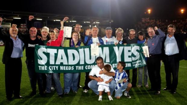 The Argus: Martin Perry, right, with the Community Stadium campaign team. Picture by Paul Hazlewood