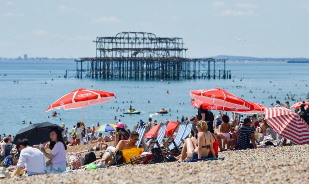 The Argus: People in Brighton hit the beaches during the heatwave - before the thunderstorms hit