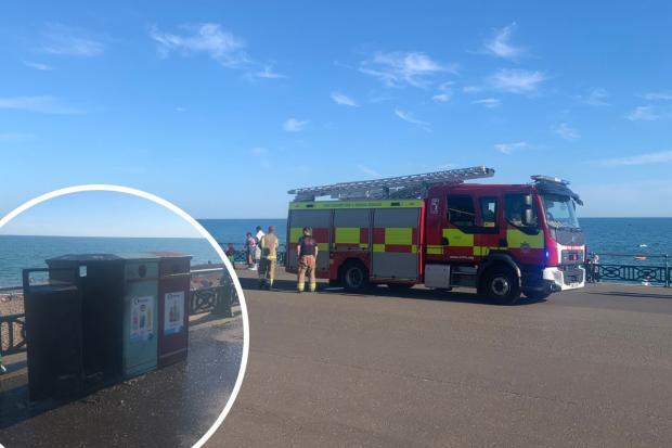 Firefighters on the beach in Hove after a bin fire on Sunday, July 10