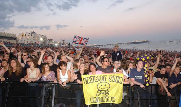 The Argus: Fans having a great time at the front. PA Photo: Yui Mok