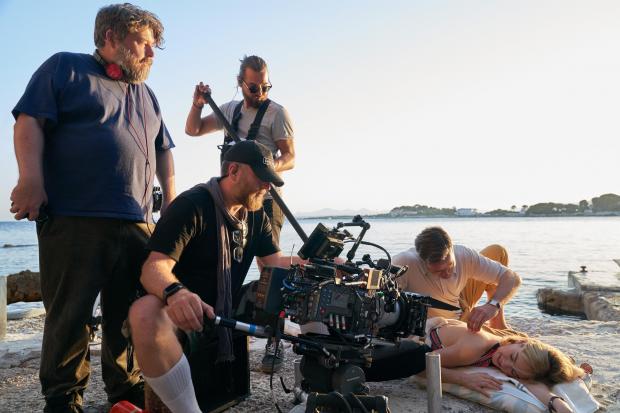 The Argus: Netflix undated handout photo showing (left to right) director Ben Wheatley, the film crew, Armie Hammer as Maxim de Winter and Lily James as Mrs de Winter in a new adaptation of Rebecca.