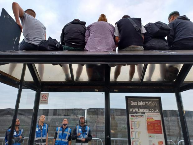 The Argus: People were up on a bus stop shelter trying to get a good view