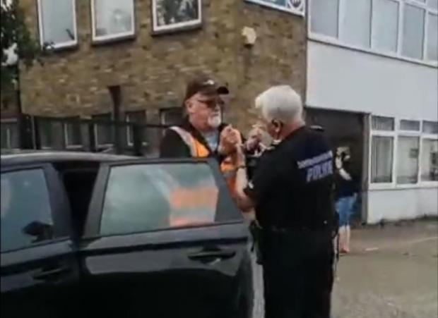 The Argus: Palmer being escorted into the car. Video from @GMBSouthern