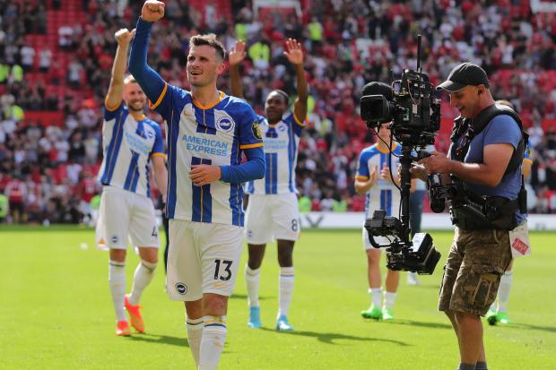Pascal Gross salutes Brighton fans after the win at Manchester United. Picture by Richard Parkes