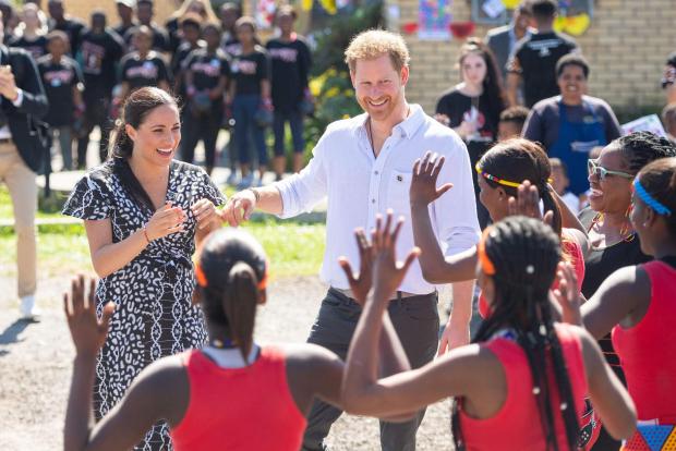 The Argus: Meghan and Harry at Nyanga Township in Cape Town, South Africa on the first day of their tour (Dominic Lipinski/PA)