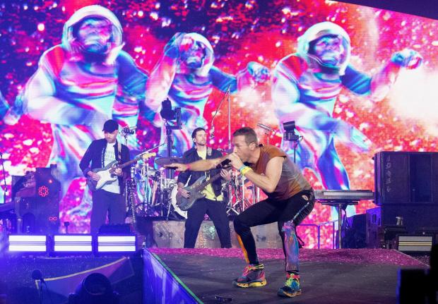 The Argus: Coldplay's Chris Martin performs on stage at Wembley Stadium in north London during their Music of the Spheres tour. Photo: PA. Picture date: Friday August 12, 2022.
