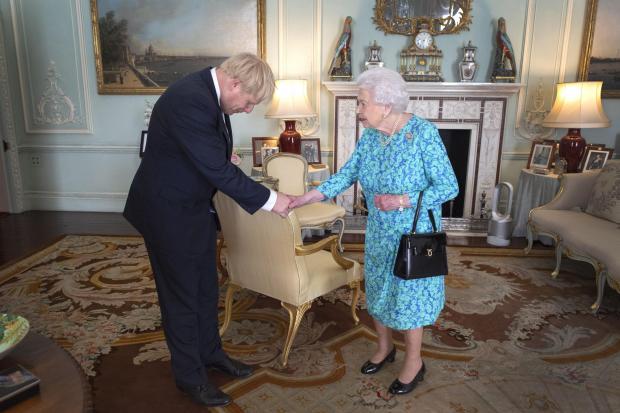 The Argus: Boris Johnson meets the Queen. Credit: PA