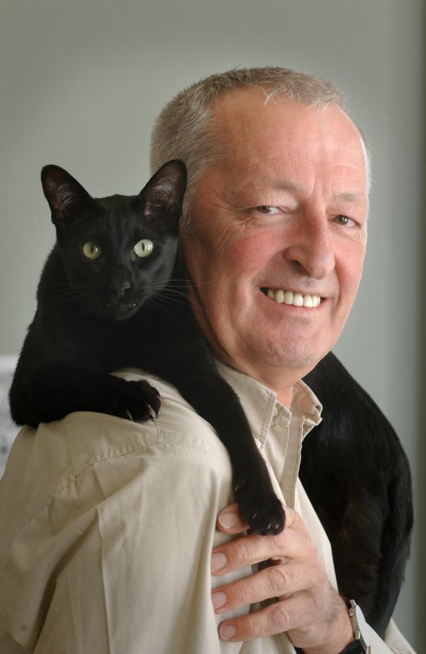 The Argus: Roger Bamber with his cat Noggin. Image by Jim Holden