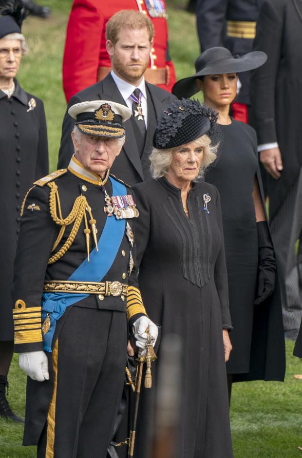 The Argus: King Charles III, the Duke of Sussex, the Queen Consort and the Duchess of Sussex stand behind the King and Queen Consort as the Queen's coffin arrived at Wellington Arch: Credit - PA
