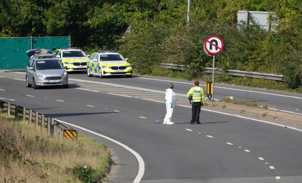 The Argus: Officers who were present at the scene have put a crime scene marker next to some wreckage in the middle of the A27: Credit - Eddie Mitchell