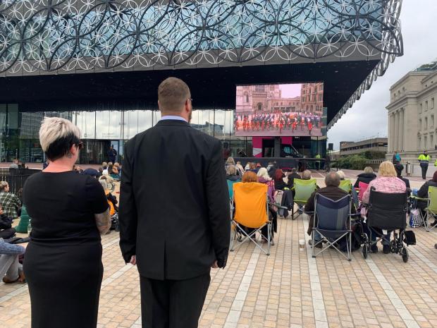 The Argus: People watch Queen Elizabeth's funeral on a big screen in Centenary Square Birmingham: PA