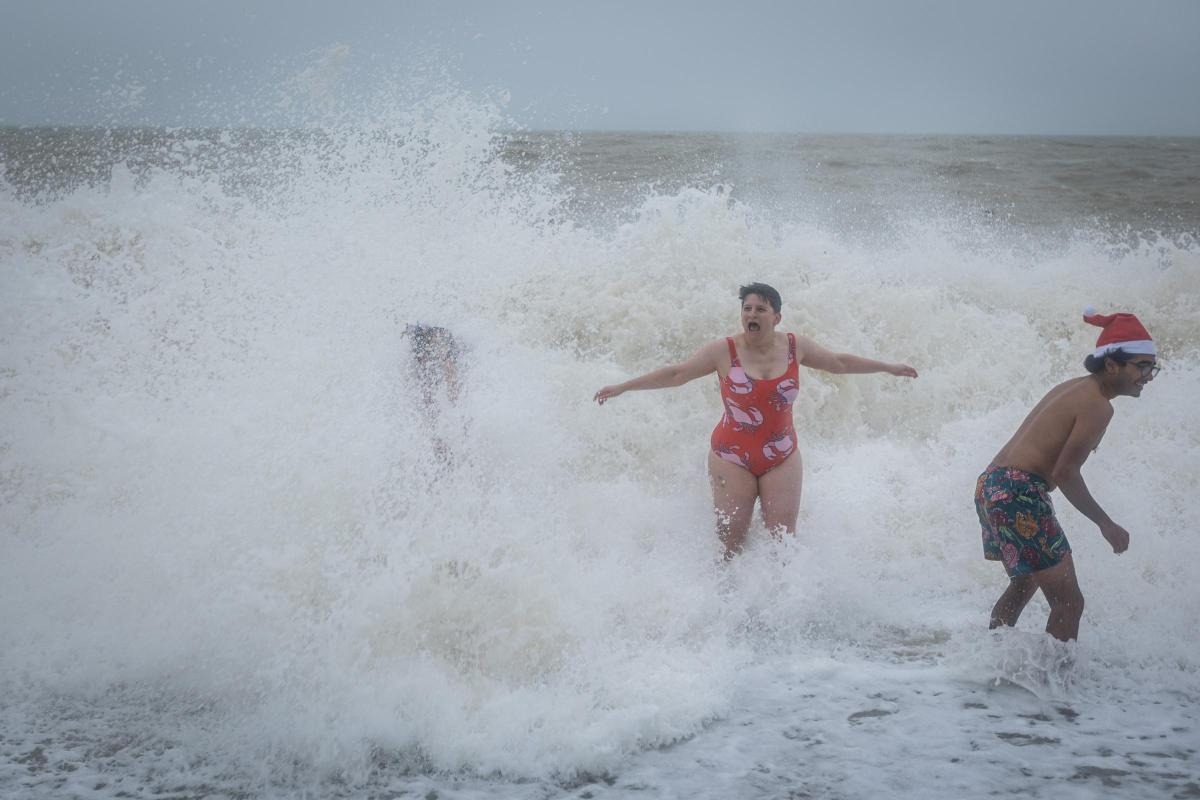 People enjoy rough seas for Brighton Christmas Day swim | The Argus