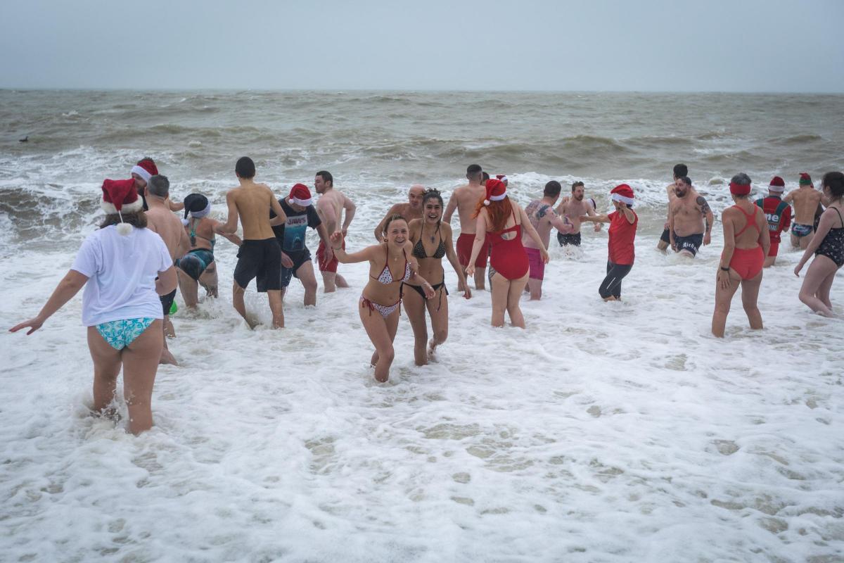 People enjoy rough seas for Brighton Christmas Day swim | The Argus