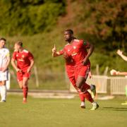 Shola Ayoola scores a late leveller for Worthing as Hastings protest. Picture: Marcus Hoare