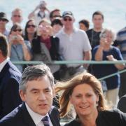 Gordon Brown, with wife Sarah, arrive in Brighton.