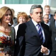 Prime Minister Gordon Brown with wife Sarah on the way to make his speech in Brighton today