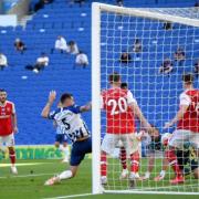 Lewis Dunk pokes home the equaliser against Arsenal during Albion's first game played behind closed doors due to coronavirus