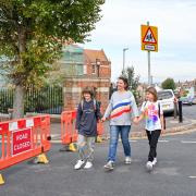 The trial bans cars and other motor vehicles outside schools at drop-off and pick-up times