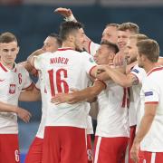 Brighton's Jakub Moder celebrates with his team-mates after Poland's 1-1 draw with Spain at Euro 2020
