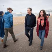 Labour leader Keir Stamer speaking with voters along Worthing promenade with Councillor Beccy Cooper, leader of the Labour group on the town's council